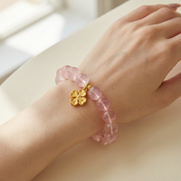 Natural Madagascar Rose Quartz Bracelet with Hand-Carved Clover - Lifestyle