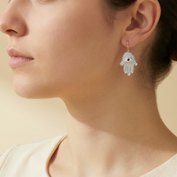 Hamsa Evil Eye Pavé Earrings - lifestyle model wearing