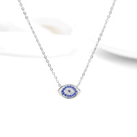 Celestial Evil Eye Zirconia Pendant with Halo Setting - front view on cream background