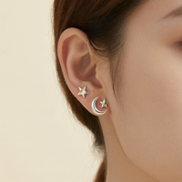 S999 Pure Silver Asymmetric Star and Moon Ear Stud Set - Lifestyle
