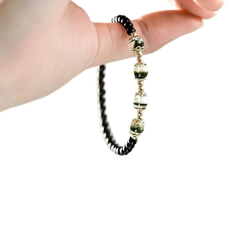 Green Phantom Quartz and Obsidian Beaded Bracelet - front view on cream background
