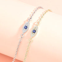 Golden Evil Eye Hand Chain Bracelet with Blue CZ Charm - detail close-up showing craftsmanship