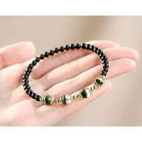Green Phantom Quartz and Obsidian Beaded Bracelet - model wearing - lifestyle styling