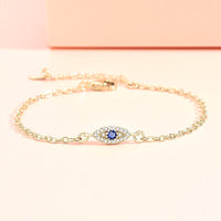 Golden Evil Eye Hand Chain Bracelet with Blue CZ Charm - alternate angle showing texture